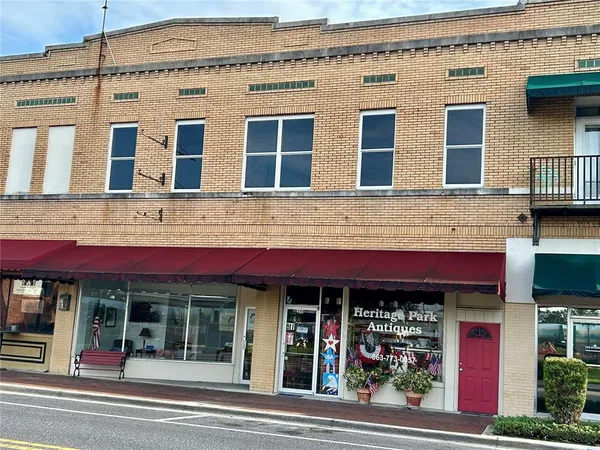 a view of a building with a window and a man seat