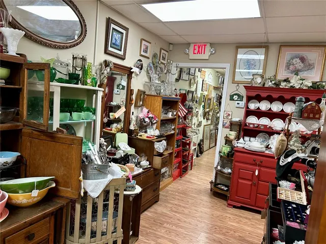 a living room filled with furniture and a wooden floor