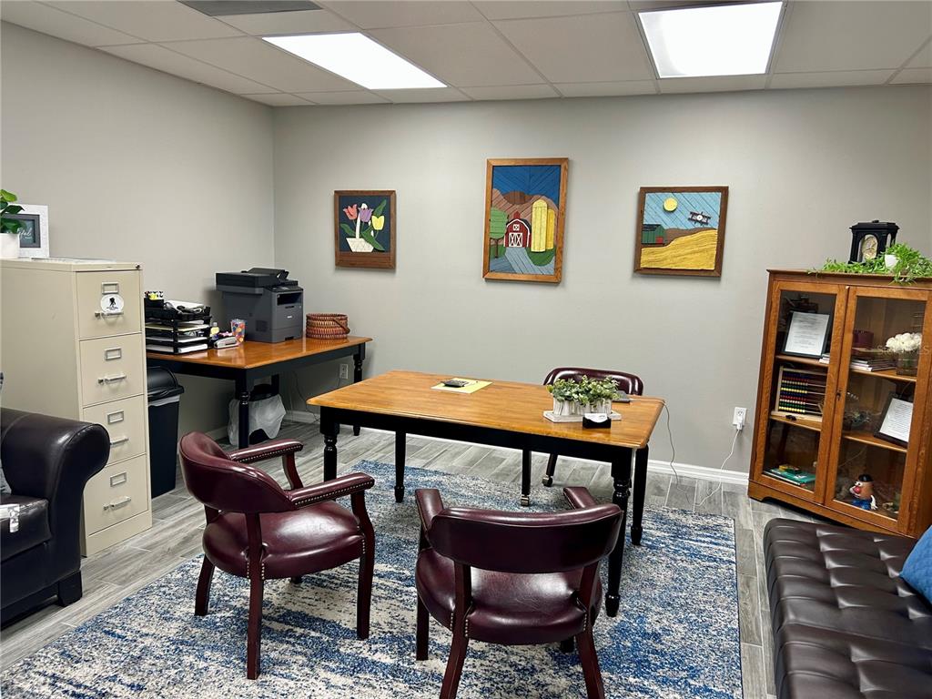 208 West Main Street Wauchula, FL 33873 - Photo 20 of 36 a room with furniture a rug and a table