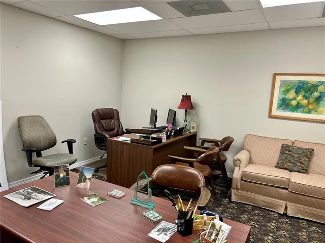 a work room with furniture and wooden floor