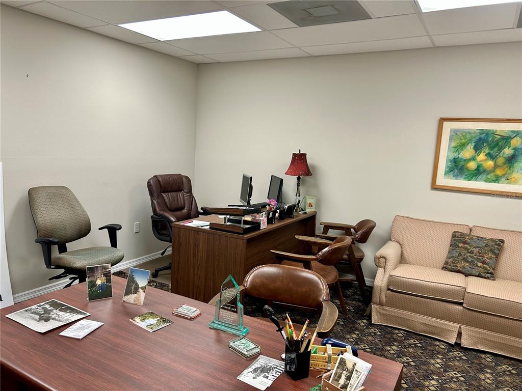 208 West Main Street Wauchula, FL 33873 - Photo 21 of 36 a work room with furniture and wooden floor