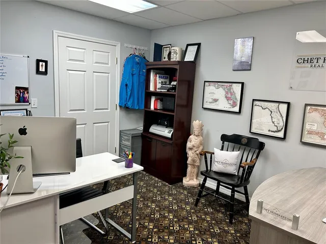 a work room with furniture and wooden floor