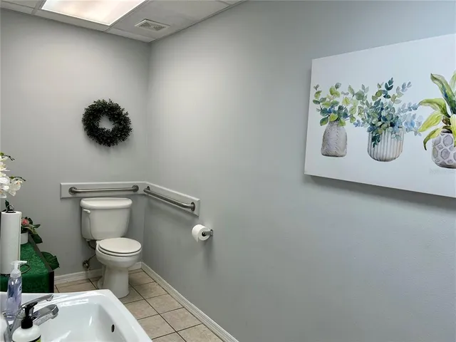 a bathroom with a toilet and a sink