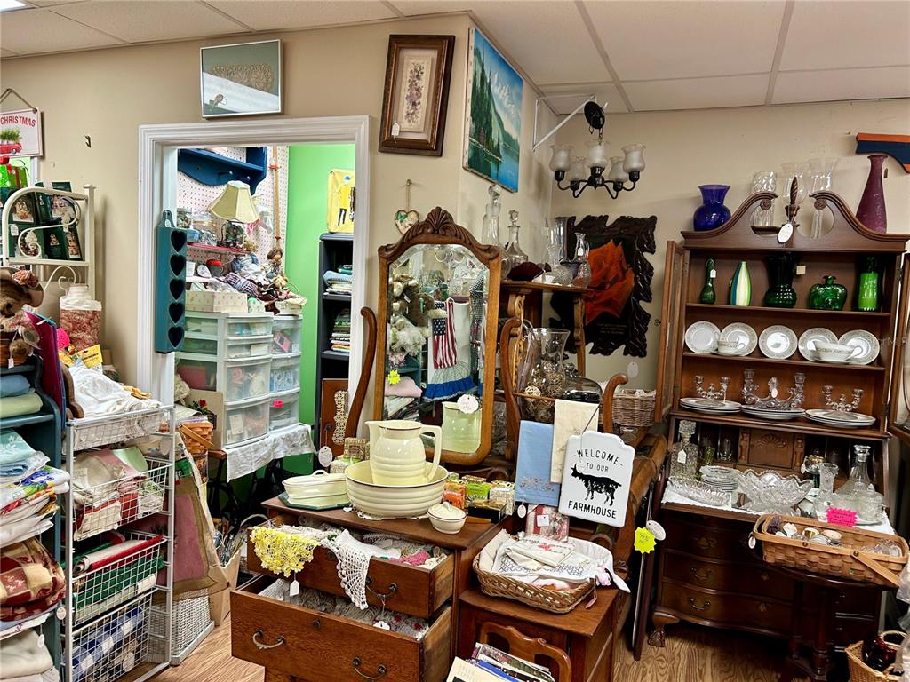 208 West Main Street Wauchula, FL 33873 - Photo 10 of 36 a work room with lots of furniture and a wooden floor