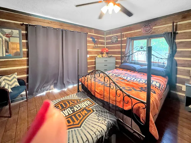 a bedroom with furniture and a window