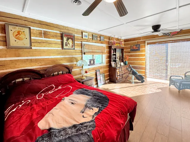 a bed sitting in a bedroom next to a window