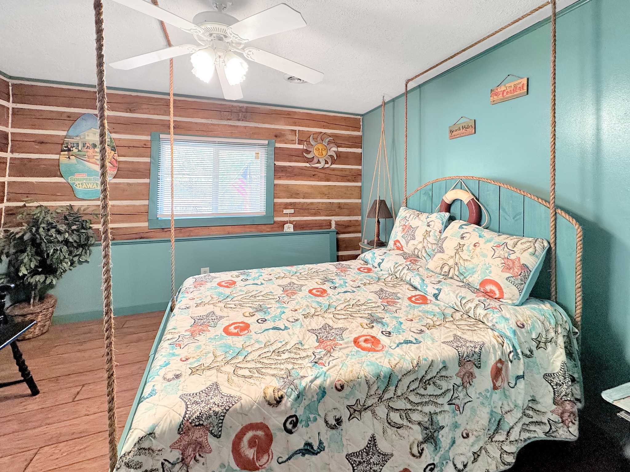 480 Hickman Shores Road Dover, TN 37058 - Photo 20 of 39 a bedroom with a bed and a chandelier