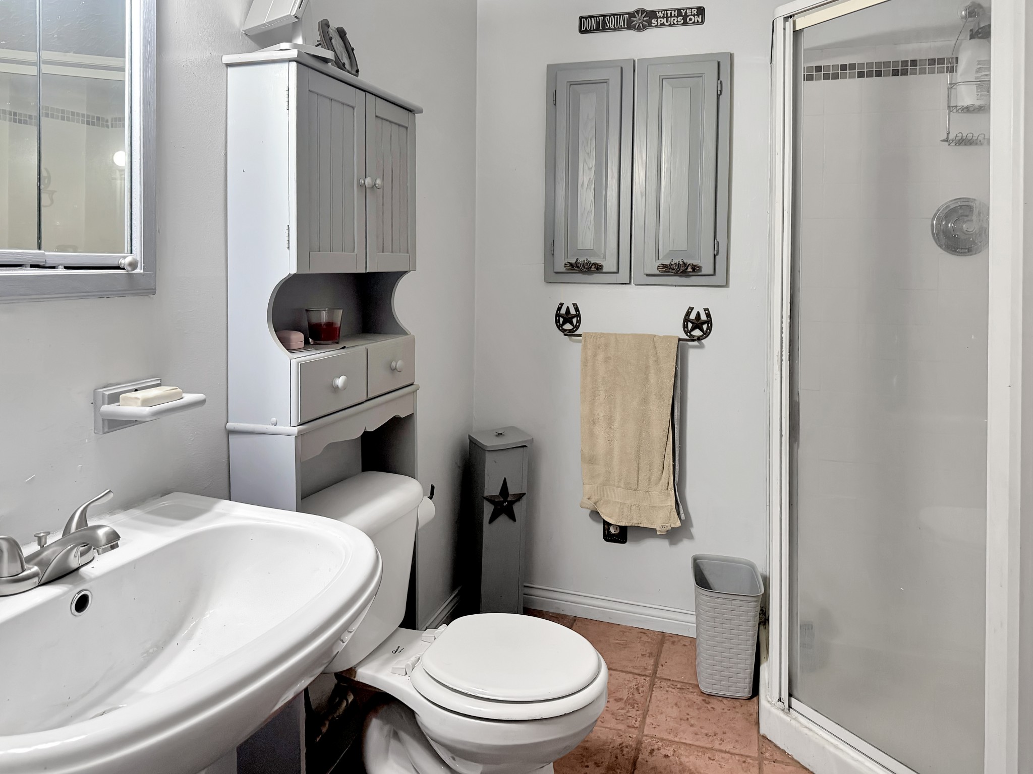 480 Hickman Shores Road Dover, TN 37058 - Photo 21 of 39 a bathroom with a sink a toilet and shower