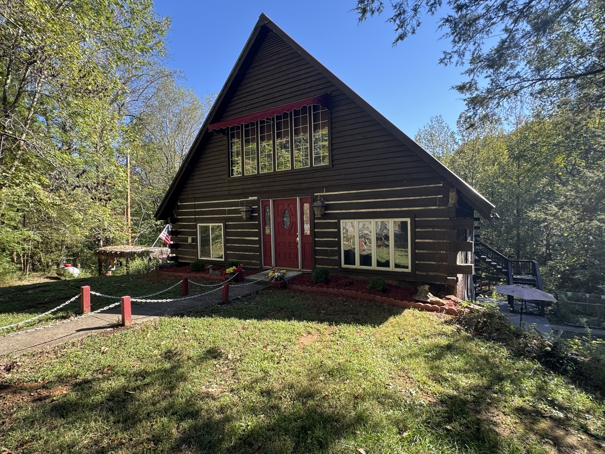 480 Hickman Shores Road Dover, TN 37058 - Photo 33 of 39 a front view of a house with a yard