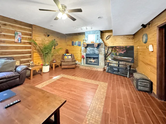 a living room with furniture and a flat screen tv