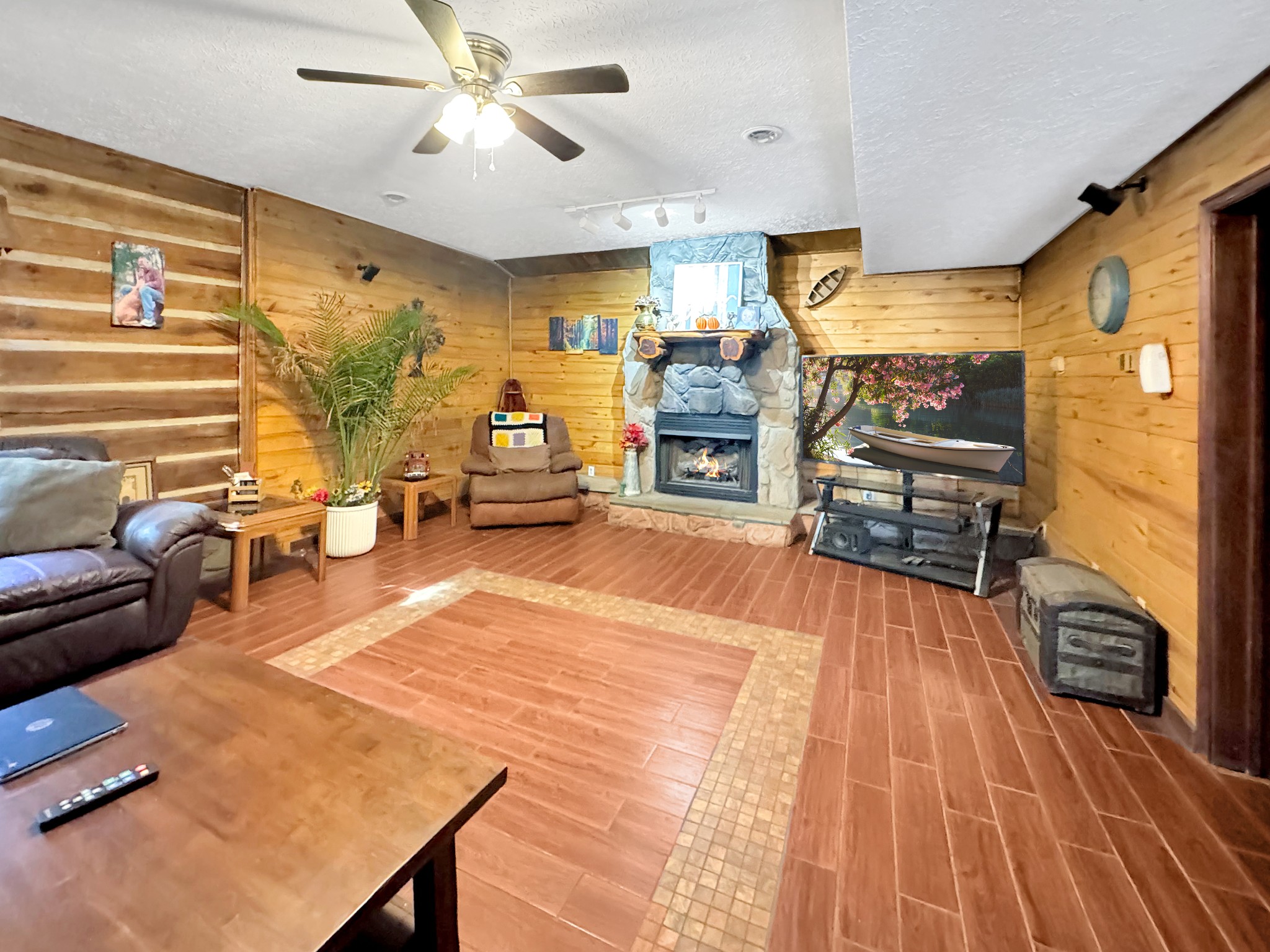 480 Hickman Shores Road Dover, TN 37058 - Photo 4 of 39 a living room with furniture and a flat screen tv