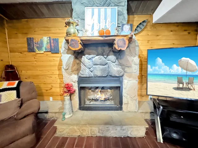 a living room with a couch and a fireplace