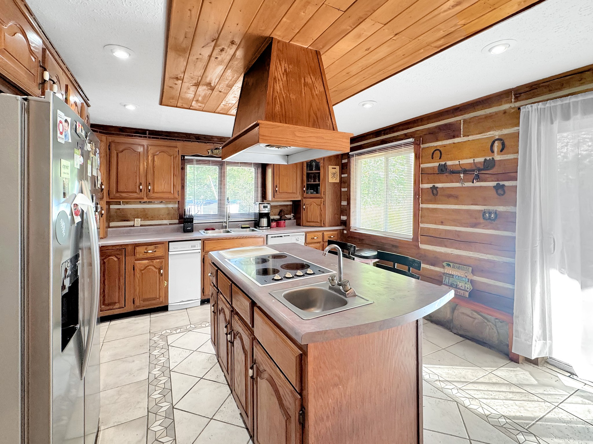 480 Hickman Shores Road Dover, TN 37058 - Photo 6 of 39 a kitchen with a sink a stove and cabinets