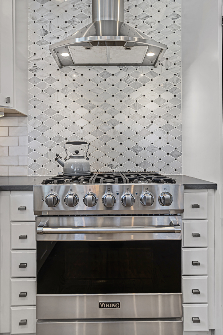 2301 West Wolfram Street, Unit 2 Chicago, IL 60618 - Photo 12 of 26 a stove top oven sitting inside of a kitchen
