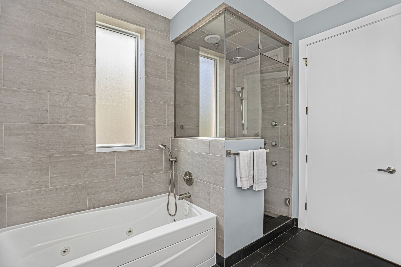 2301 West Wolfram Street, Unit 2 Chicago, IL 60618 - Photo 16 of 26 a bathroom with a bathtub and a shower