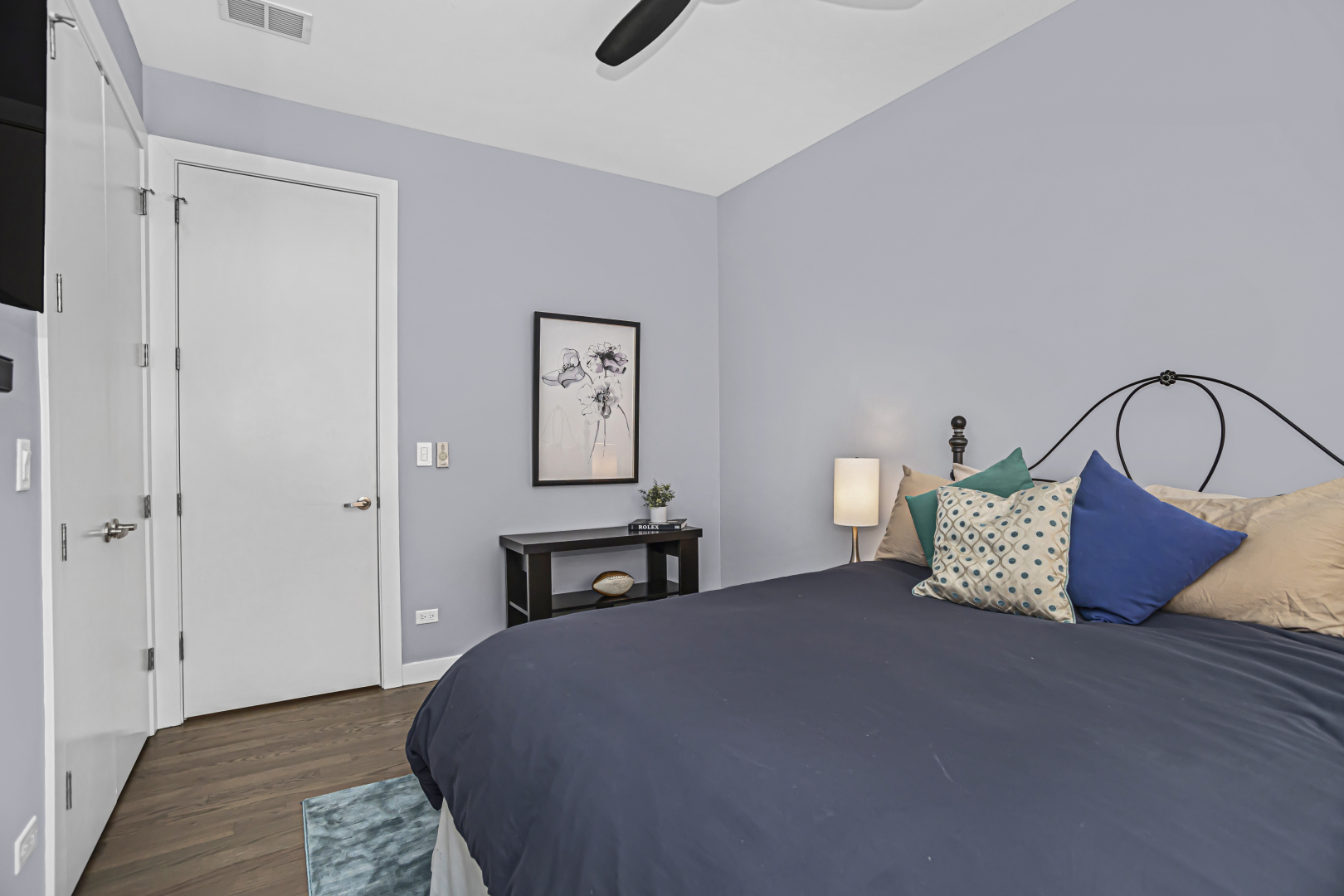2301 West Wolfram Street, Unit 2 Chicago, IL 60618 - Photo 20 of 26 a bedroom with a bed table and a window