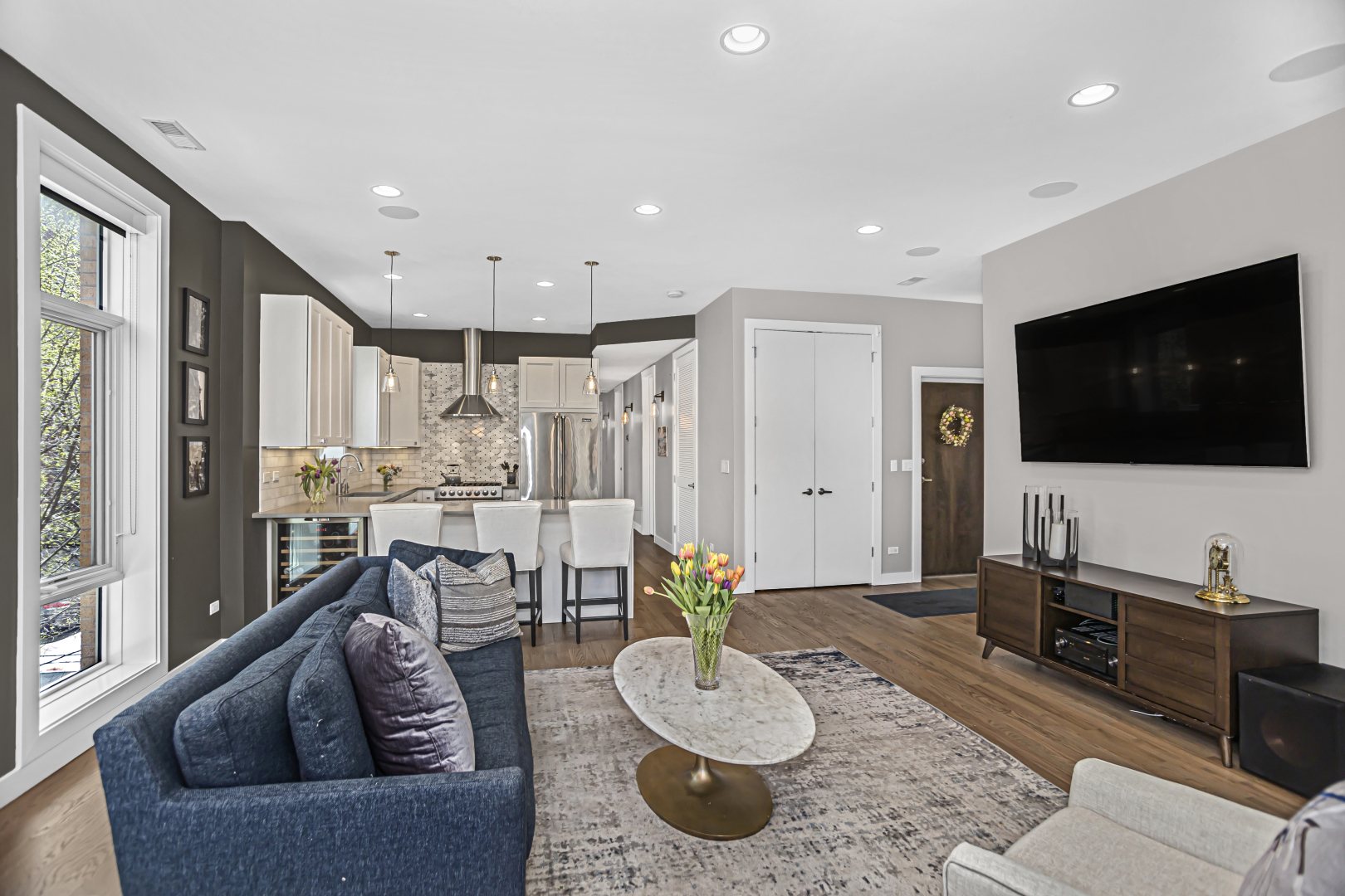 2301 West Wolfram Street, Unit 2 Chicago, IL 60618 - Photo 4 of 26 a living room with furniture and a flat screen tv