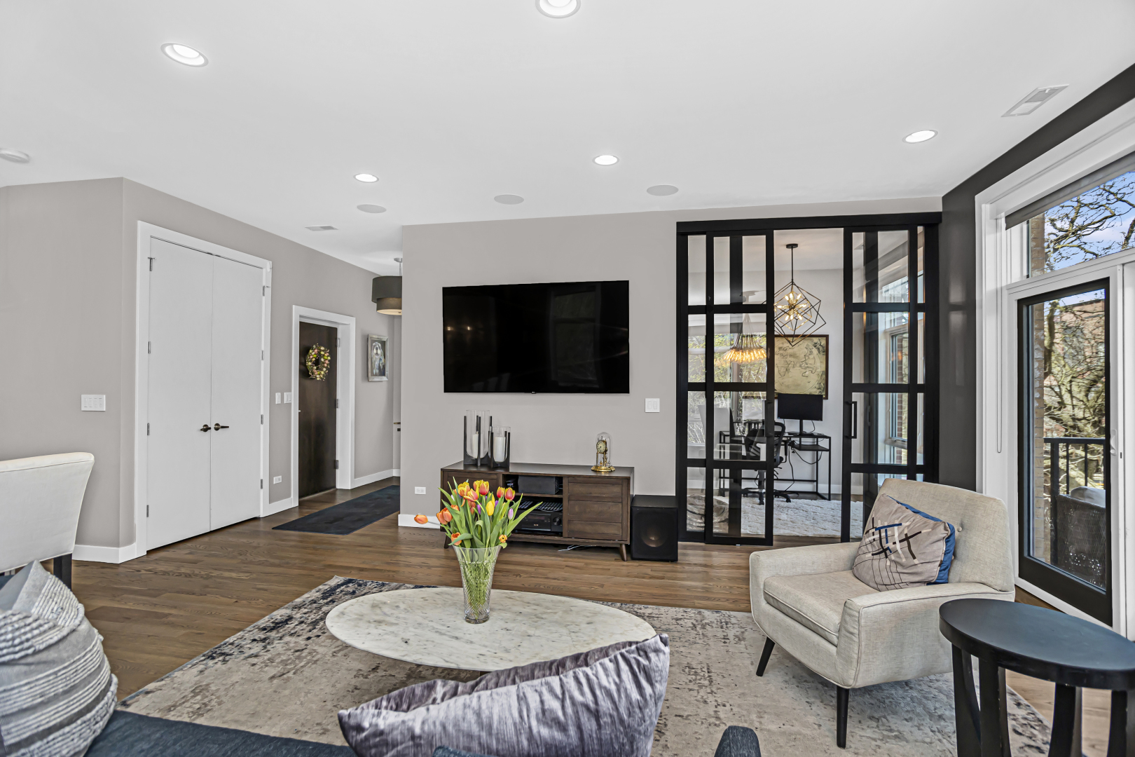 2301 West Wolfram Street, Unit 2 Chicago, IL 60618 - Photo 5 of 26 a living room with furniture and a flat screen tv