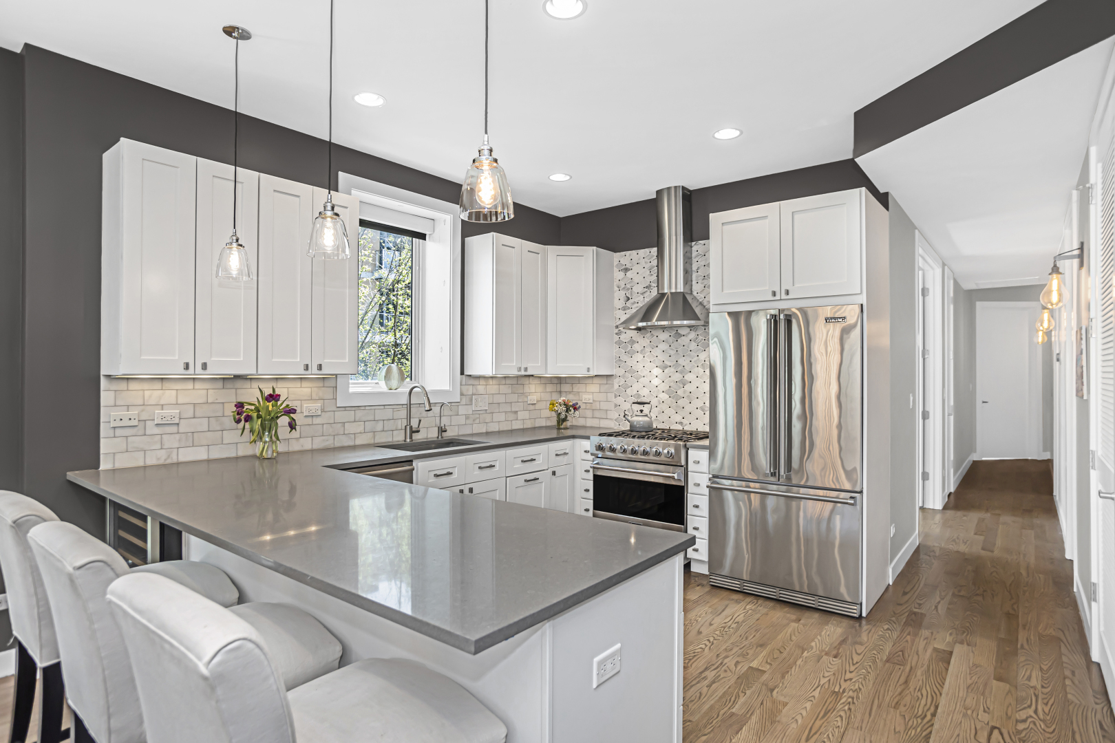 2301 West Wolfram Street, Unit 2 Chicago, IL 60618 - Photo 10 of 26 a kitchen with stainless steel appliances granite countertop a refrigerator a sink and a stove