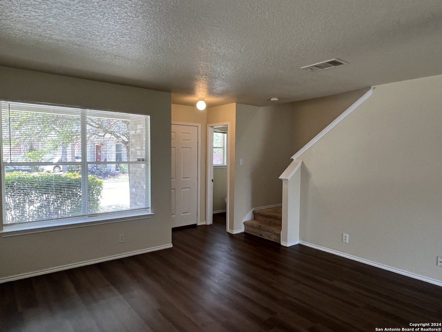 10118 Figaro San Antonio, TX 78260 - Photo 3 of 20 a view of empty room with wooden floor and fan