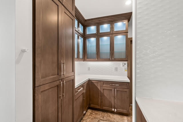 7339 Mandarin Drive Boca Raton, FL 33433 - Photo 13 of 47 a kitchen with a refrigerator and cabinets