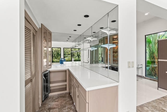 7339 Mandarin Drive Boca Raton, FL 33433 - Photo 14 of 47 a view of a kitchen with a sink and large window