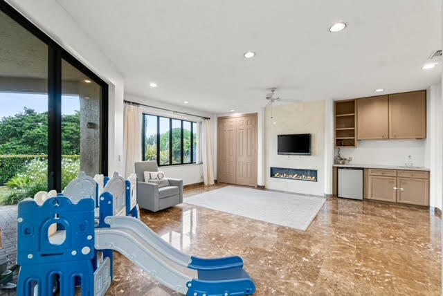 7339 Mandarin Drive Boca Raton, FL 33433 - Photo 16 of 47 a living room with furniture and a flat screen tv