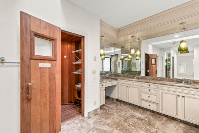 7339 Mandarin Drive Boca Raton, FL 33433 - Photo 24 of 47 a spacious bathroom with a granite countertop sink and a mirror
