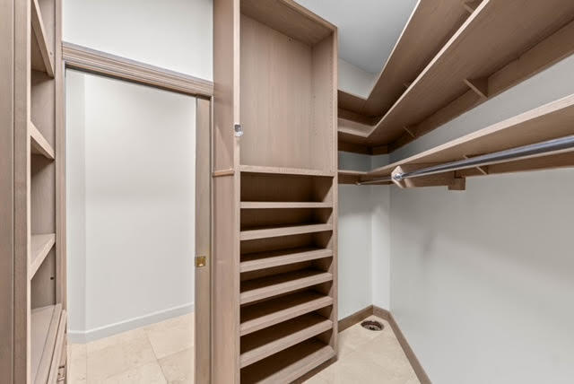 7339 Mandarin Drive Boca Raton, FL 33433 - Photo 25 of 47 a view of walk in closet with empty racks