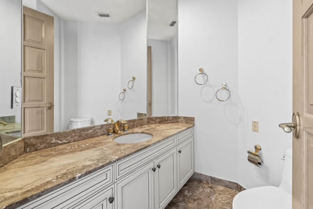 7339 Mandarin Drive Boca Raton, FL 33433 - Photo 28 of 47 a bathroom with a granite countertop sink and a mirror