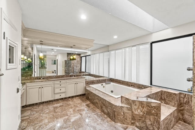 7339 Mandarin Drive Boca Raton, FL 33433 - Photo 29 of 47 a bathroom with a tub sink and mirror