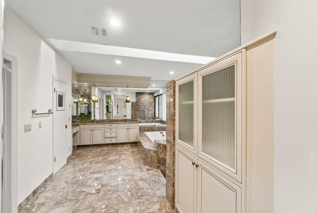 7339 Mandarin Drive Boca Raton, FL 33433 - Photo 30 of 47 a bathroom with a tub mirror vanity and toilet