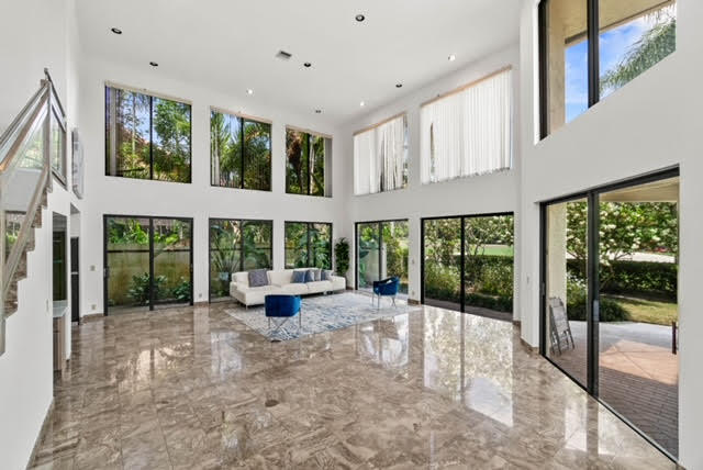 7339 Mandarin Drive Boca Raton, FL 33433 - Photo 5 of 47 a lobby with furniture and garden view