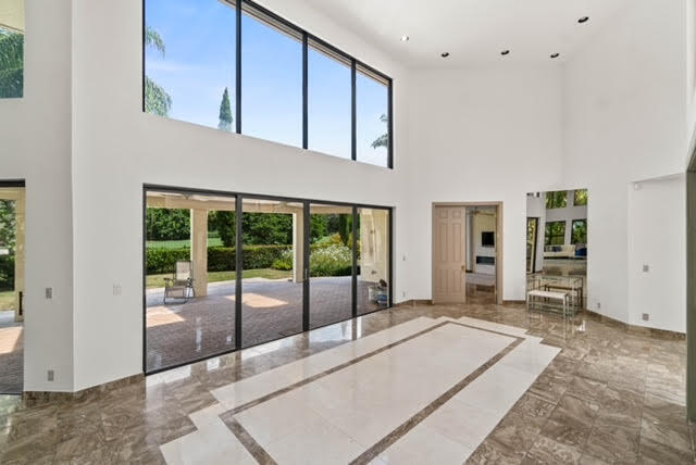 7339 Mandarin Drive Boca Raton, FL 33433 - Photo 6 of 47 a spacious bedroom with a large window and walk in closet