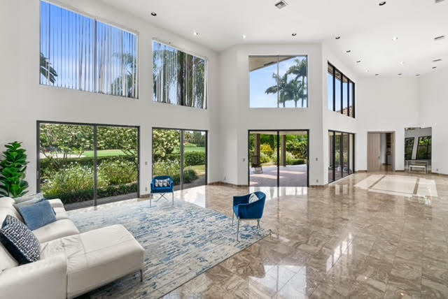 7339 Mandarin Drive Boca Raton, FL 33433 - Photo 7 of 47 a living room with furniture large window and floor to ceiling window