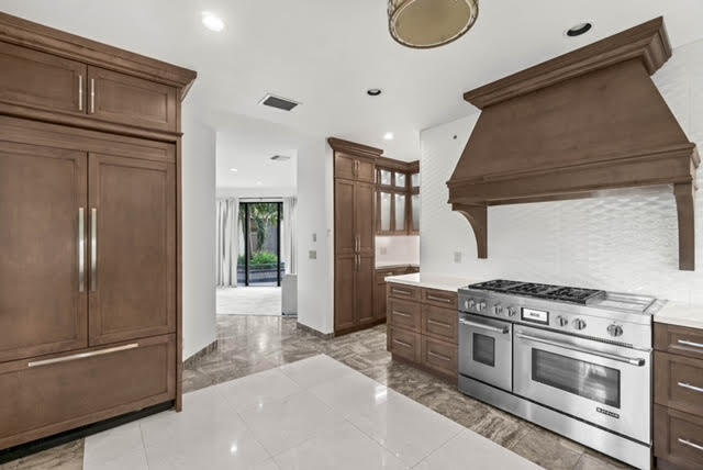 7339 Mandarin Drive Boca Raton, FL 33433 - Photo 10 of 47 a kitchen with stainless steel appliances granite countertop a stove and a refrigerator