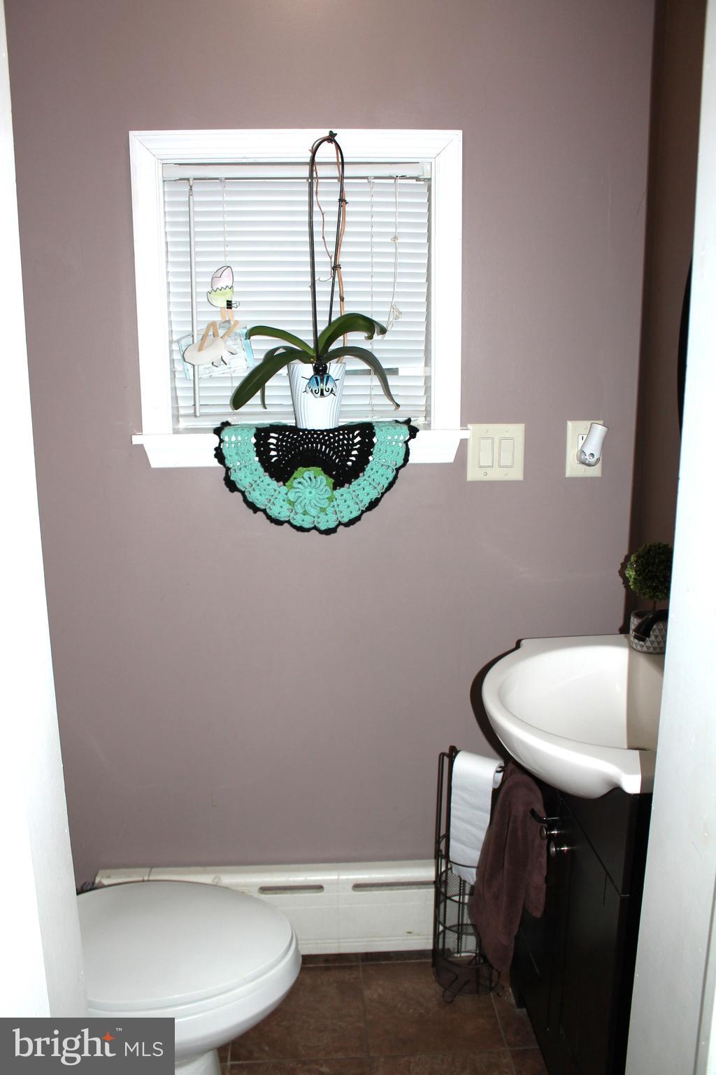 3431 Fairfield Street Reading, PA 19605 - Photo 14 of 15 a bathroom with a sink toilet and mirror