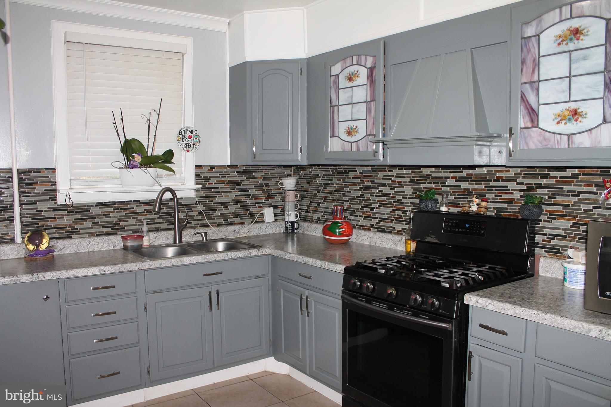 3431 Fairfield Street Reading, PA 19605 - Photo 6 of 15 a kitchen with a sink and a stove