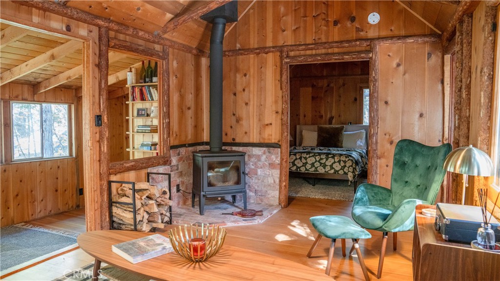 25201 Fern Valley Road Idyllwild, CA 92549 - Photo 13 of 34 a living room with furniture a rug and a window