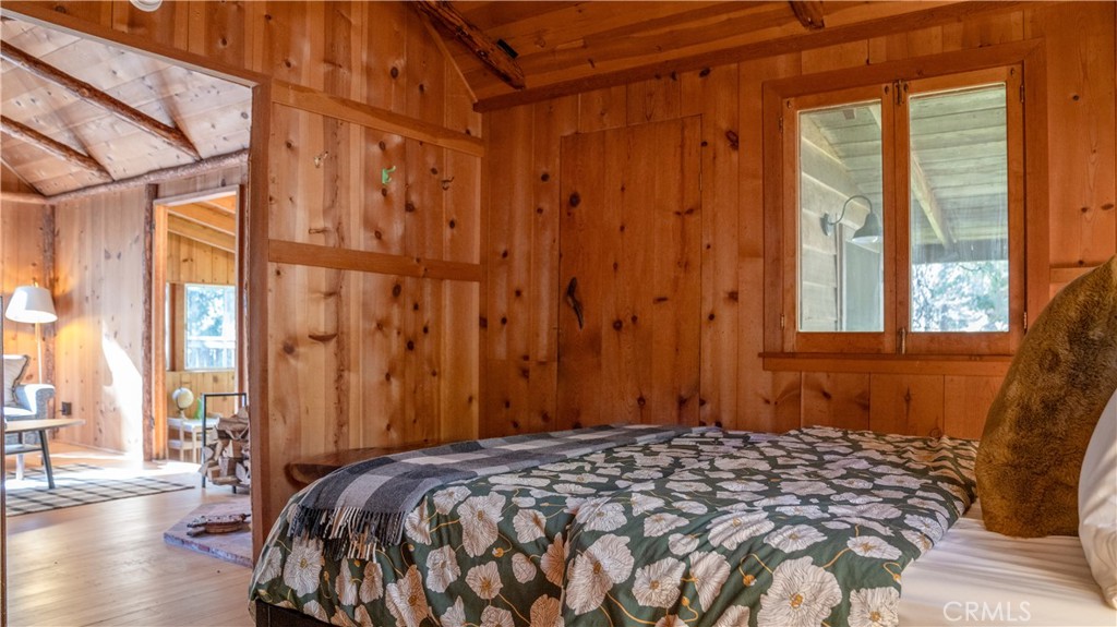 25201 Fern Valley Road Idyllwild, CA 92549 - Photo 21 of 34 a bedroom with a bed and a window