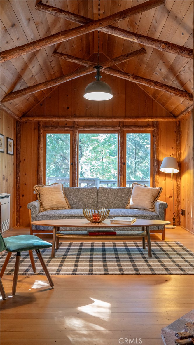 25201 Fern Valley Road Idyllwild, CA 92549 - Photo 33 of 34 a view of a dining room with furniture wooden floor and a table