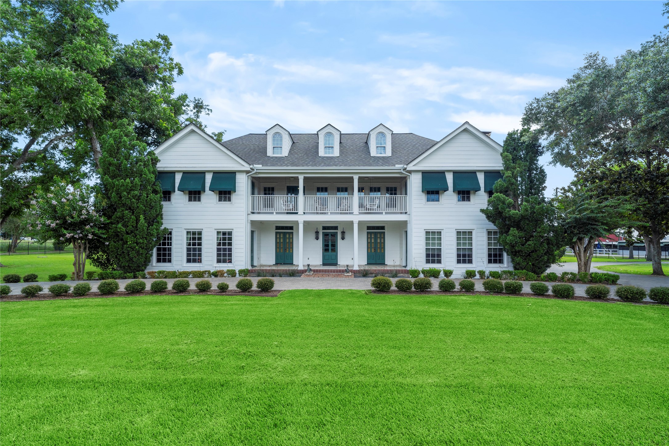 9827 FM 2759 Road Richmond, TX 77469 - Photo 3 of 50 a front view of a house with garden and trees