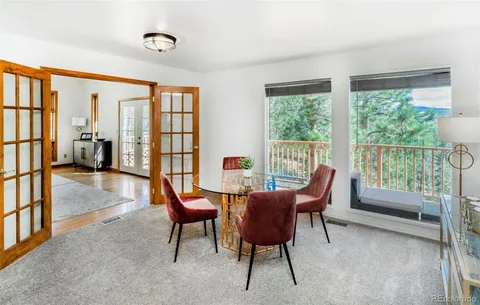 a view of a livingroom with furniture and a window