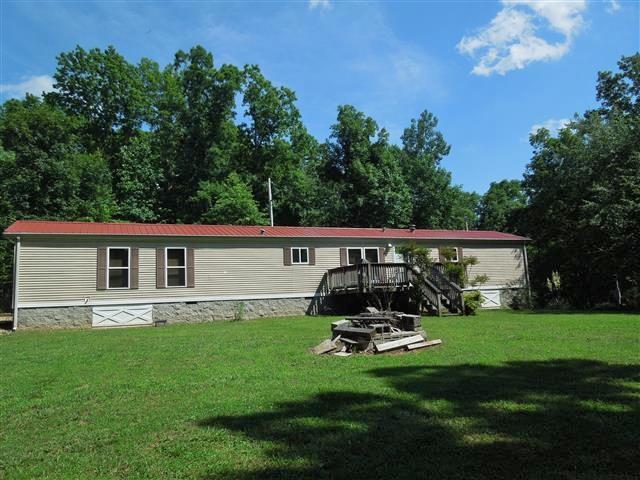 680 Edenway Road Dover, TN 37058 - Photo 1 of 20 Nice 1997 Dutch mobile home, on permanent foundation & sitting on 4.8 acres+/-. Front View.