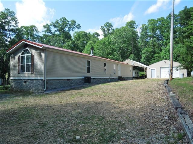 680 Edenway Road Dover, TN 37058 - Photo 2 of 20 Back view; actually how you drive up on the property. Nice garage-workshop and separate carport.