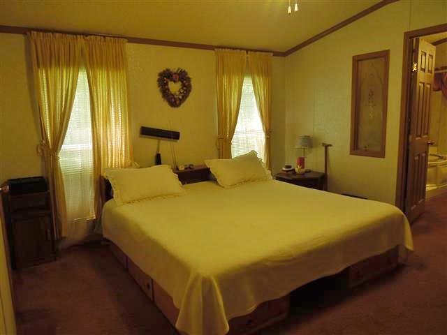 680 Edenway Road Dover, TN 37058 - Photo 17 of 20 Master Bedroom, spacious closet and adjoining Master bath.