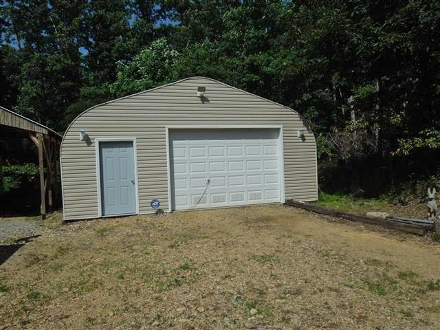 680 Edenway Road Dover, TN 37058 - Photo 3 of 20 24'x40' metal garage - front vinyl, concrete floor, electric service w/2220 plugs.