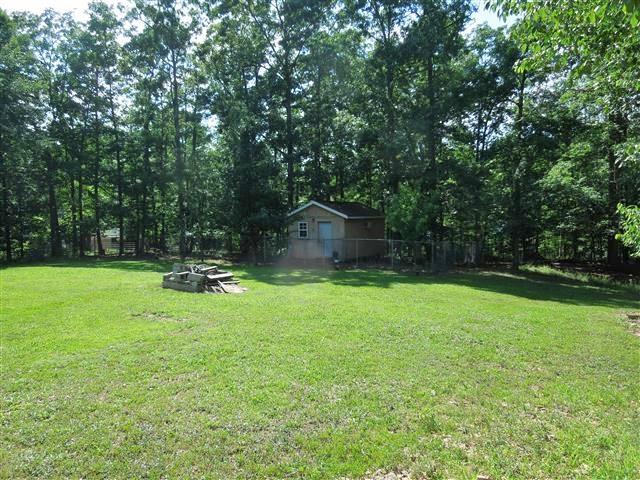 680 Edenway Road Dover, TN 37058 - Photo 5 of 20 Neat workshop/pet grooming station/or man cave. Well insulated building w/electric & water, window unit AC, and propane wall unit. (No propane tank.)
