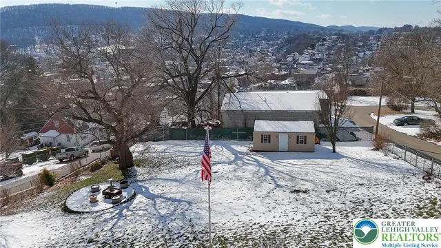 a view of a backyard with furniture