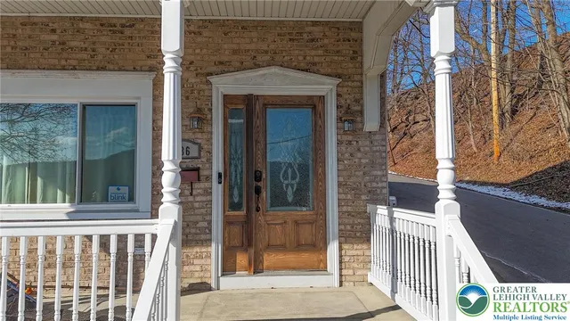 a front view of a house with a porch